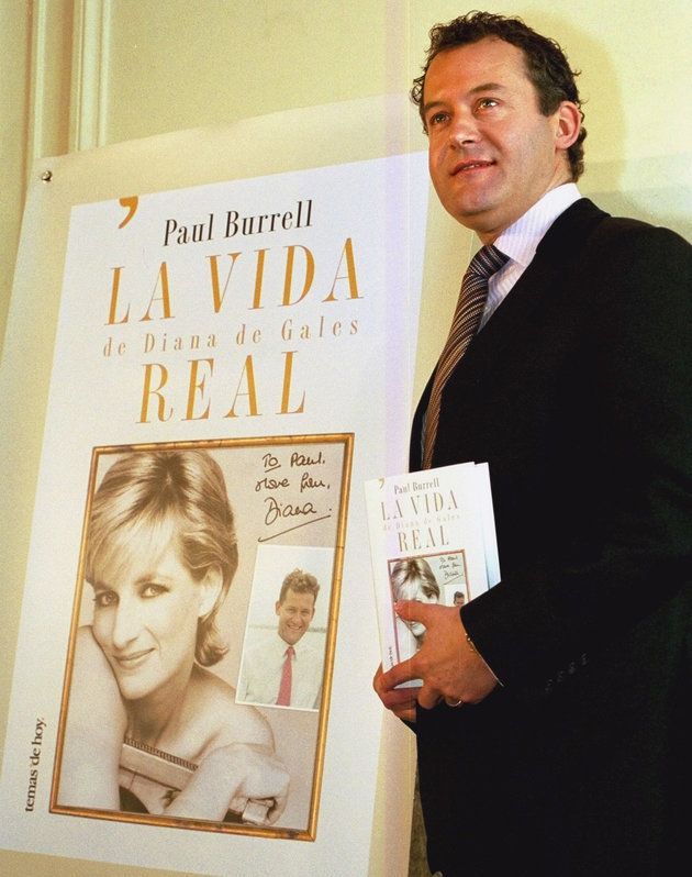 Burrell poses with a copy of the Spanish version of his book, 'A Royal Duty' in 2004 