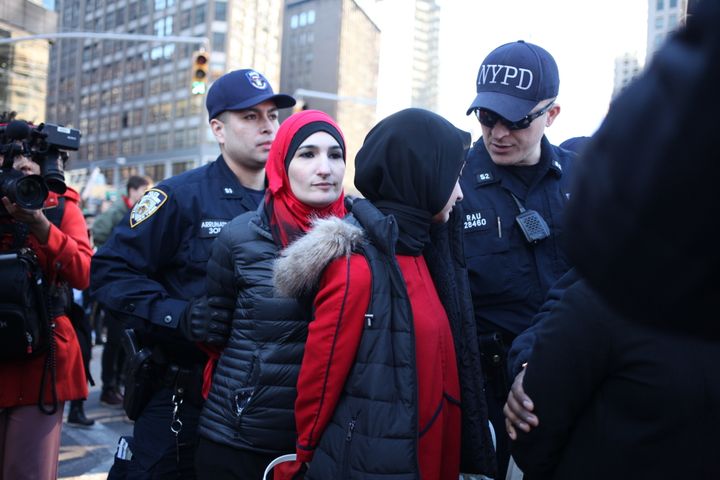 Protesters getting arrested during "A Day Without A Woman" strike outside of Trump International Hotel.