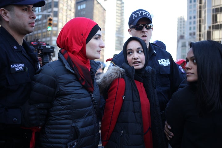 Protesters getting arrested during "A Day Without A Woman" strike outside of Trump International Hotel.