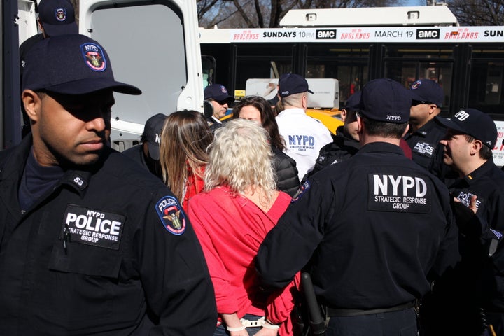 Protesters getting arrested during "A Day Without A Woman" strike outside of Trump International Hotel.