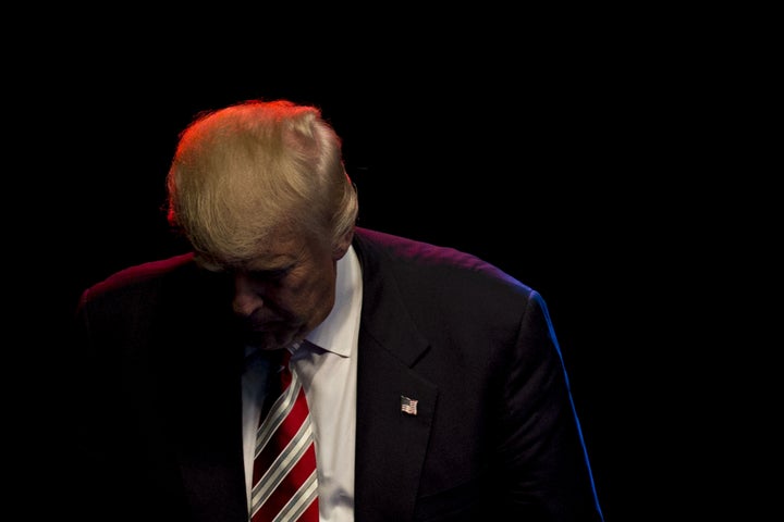 Trump exits the stage after speaking at a campaign event in Des Moines, Iowa. Sept. 13, 2016.