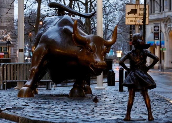 Placing the diminutive, grade school-aged girl in front of the massive bull on the eve of International Women's Day was a way of calling attention to the lack of gender diversity on corporate boards and the pay gap of women working in financial services, a spokeswoman for State Street Global Advisors said. (Reuters)