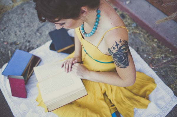 A photo of the bride "with her nose stuck in a book" is a must. <em>Related: <a href="http://www.bridalguide.com/planning/the-details/photo-video/bridal-portraits" target="_blank" role="link" rel="nofollow" class=" js-entry-link cet-external-link" data-vars-item-name="33 Tips for Taking Beautiful Bridal Portraits" data-vars-item-type="text" data-vars-unit-name="58c0aaaee4b0a797c1d398f0" data-vars-unit-type="buzz_body" data-vars-target-content-id="http://www.bridalguide.com/planning/the-details/photo-video/bridal-portraits" data-vars-target-content-type="url" data-vars-type="web_external_link" data-vars-subunit-name="article_body" data-vars-subunit-type="component" data-vars-position-in-subunit="2">33 Tips for Taking Beautiful Bridal Portraits</a></em>