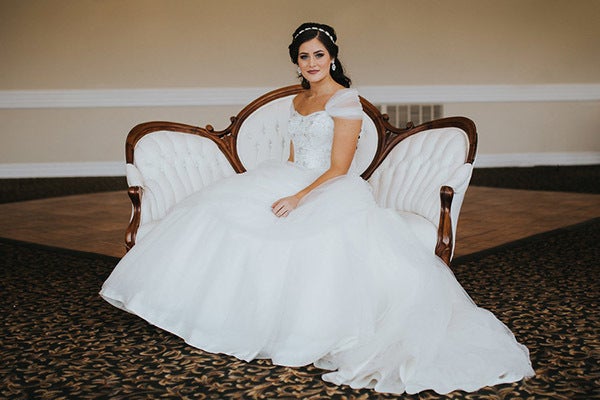 A yellow gown isn't the only way to channel Belle; instead, mirror her romantic look with an off-the-shoulder ballgown. Related: 50+ Beautiful New Wedding Ball Gowns