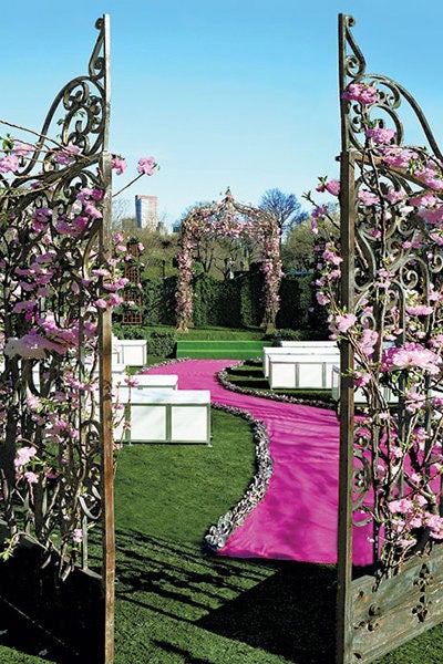 Adorn the castle's gates with lush flowers. Related: 40 Ways to Decorate Your Ceremony Aisle