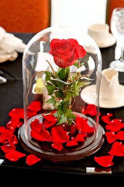 The enchanted rose is a simple centerpiece that everyone will instantly recognize as <em>Beauty and the Beast</em>-inspired. <em>Related: <a href="http://www.bridalguide.com/planning/wedding-reception/gorgeous-tall-centerpieces" target="_blank" role="link" rel="nofollow" class=" js-entry-link cet-external-link" data-vars-item-name="75+ Gorgeous Tall Centerpieces" data-vars-item-type="text" data-vars-unit-name="58c0aaaee4b0a797c1d398f0" data-vars-unit-type="buzz_body" data-vars-target-content-id="http://www.bridalguide.com/planning/wedding-reception/gorgeous-tall-centerpieces" data-vars-target-content-type="url" data-vars-type="web_external_link" data-vars-subunit-name="article_body" data-vars-subunit-type="component" data-vars-position-in-subunit="11">75+ Gorgeous Tall Centerpieces</a></em>