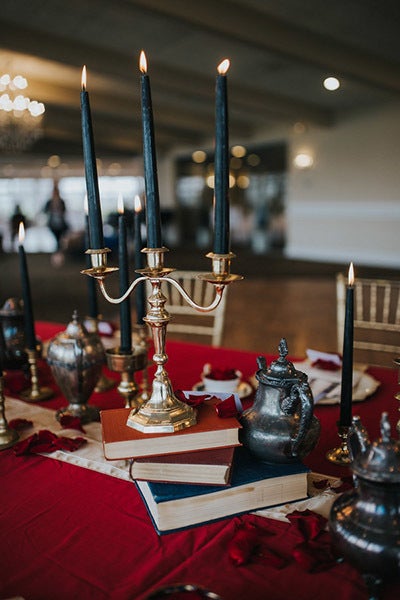 Opt for black candles to pay homage to the castle's curse. <em>Related: <a href="http://www.bridalguide.com/blogs/bridal-buzz/halloween-wedding-ideas" target="_blank" role="link" rel="nofollow" class=" js-entry-link cet-external-link" data-vars-item-name="The Spookiest Halloween Weddings We've Ever Seen" data-vars-item-type="text" data-vars-unit-name="58c0aaaee4b0a797c1d398f0" data-vars-unit-type="buzz_body" data-vars-target-content-id="http://www.bridalguide.com/blogs/bridal-buzz/halloween-wedding-ideas" data-vars-target-content-type="url" data-vars-type="web_external_link" data-vars-subunit-name="article_body" data-vars-subunit-type="component" data-vars-position-in-subunit="14">The Spookiest Halloween Weddings We've Ever Seen</a></em>
