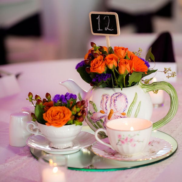 A pretty tea set makes a perfectly charming centerpiece. Related: 50 Ideas for a Vintage-Inspired Wedding