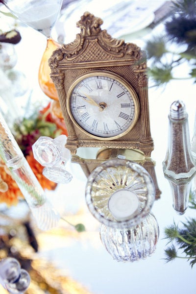 Add a clock to your tablescape as a nod to Cogsworth. Related: 50 Gorgeous Ways to Dress Up Your Reception Tables