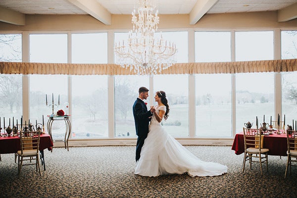 Share a dance beneath a chandelier, just like in the castle's ballroom. Related: 75+ New Must-Have Photos With Your Groom