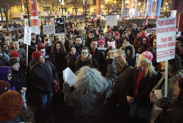 The International Women's Day rally carries into the night in Chicago.