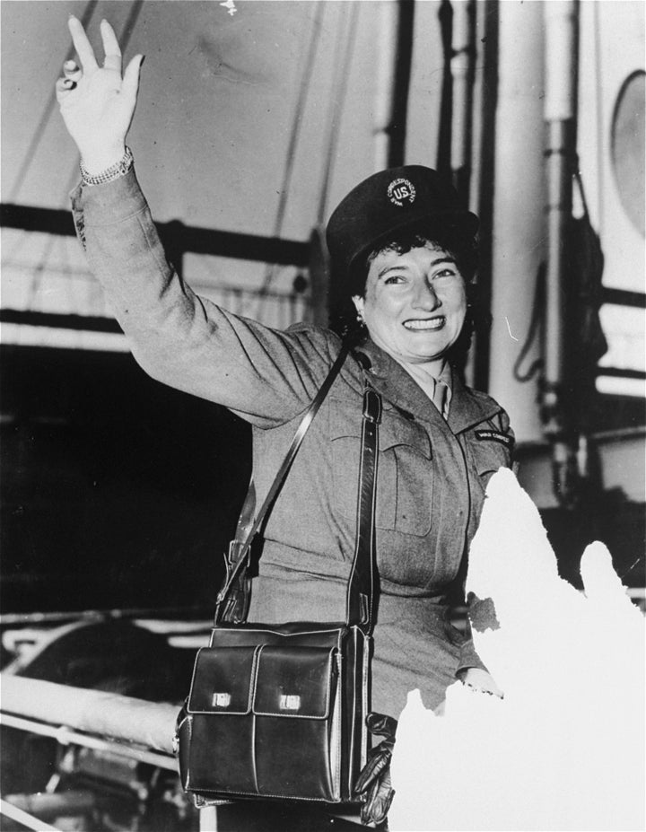 Ruth Gruber waves from the deck of the Henry Gibbins in August 1944. The main picture is of Refugee youths posing in a dinin