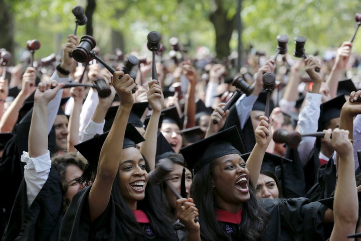 Students graduating from the School of Law cheer as they receive their degrees during the 364th Commencement Exercises at Har