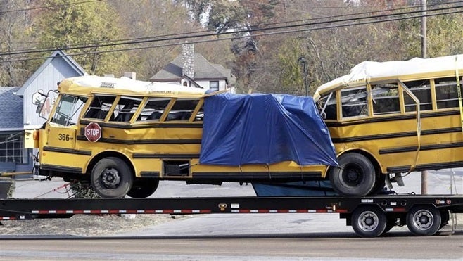 A school bus is carried away from a crash site in November in Chattanooga, Tennessee. Six elementary school students died and