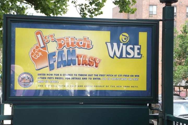 Subway entrance with ad linking snack chips to sport