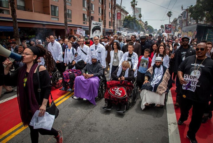 Do No Harm Coalition members march with activists on hunger strike to demand justice for individuals killed by SFPD officers.