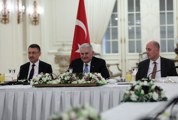 Prime Minister Binali Yildirim (center) told a group of foreign reporters on Thursday that he is optimistic about improved U.S.-Turkey relations under President Donald Trump.