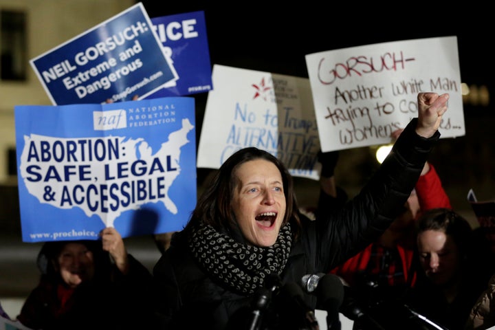 Protesters rally outside the Supreme Court against President Donald Trump's Supreme Court nominee Neil Gorsuch on the da