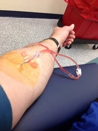 Plasma donors are hooked to a machine that withdraws blood, separates the platelets from the plasma, puts the platelets back