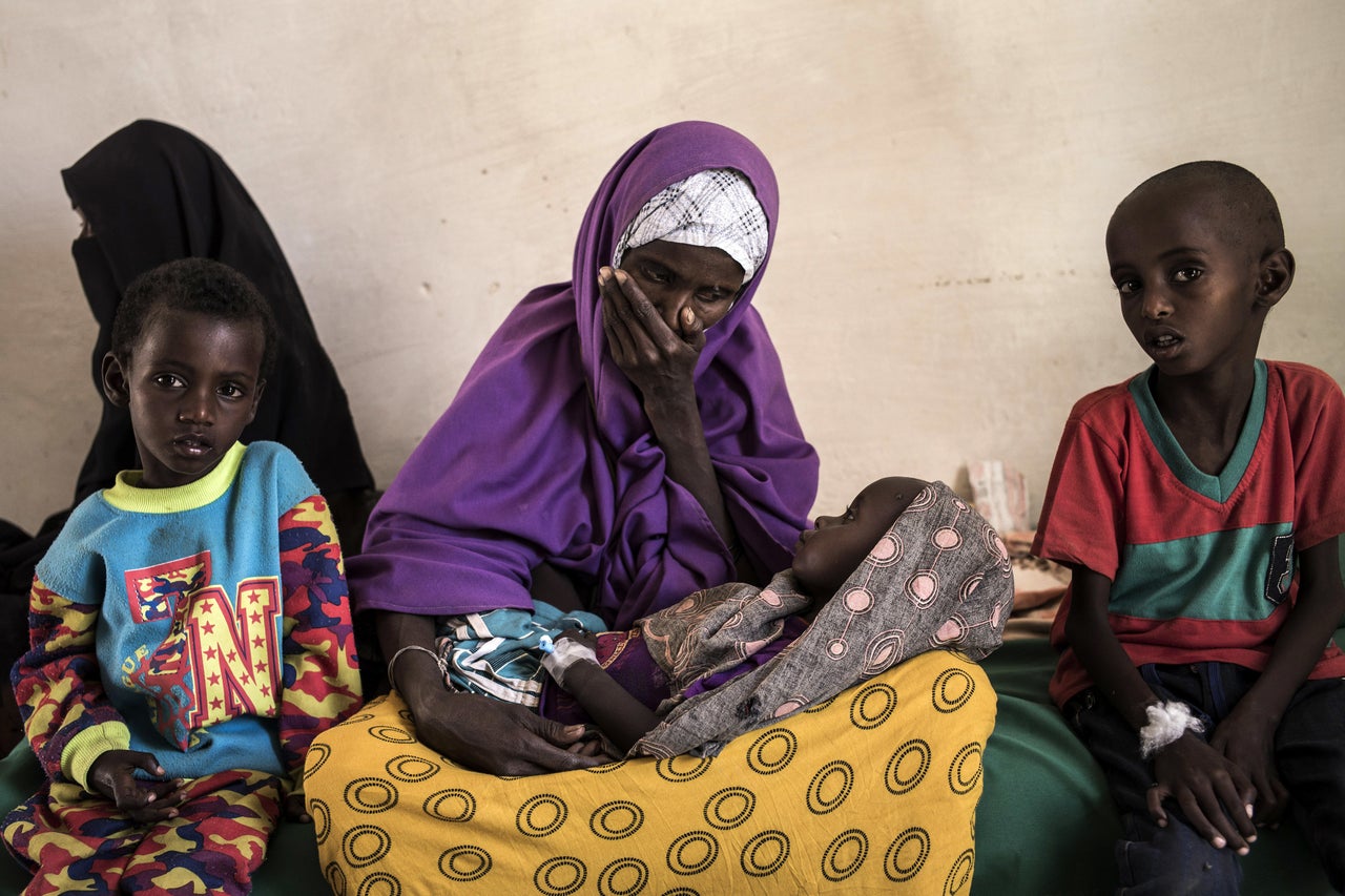 Sahro Mohamed Mumin looks at her 2-year-old son who was diagnosed with pneumonia and severe malnutrition at a government-run health clinic on Feb. 25 in Shada, Somalia. Mumin's family lost all of their animals due to drought and had traveled 150 kilometers in search of a better situation. Somalia is currently on the brink of famine with almost half of the country's population facing acute food insecurity, according to the United Nations.