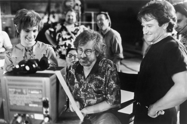 Julia Roberts and Robin Williams watch daily production footage with director Steven Spielberg on the set of "Hook."