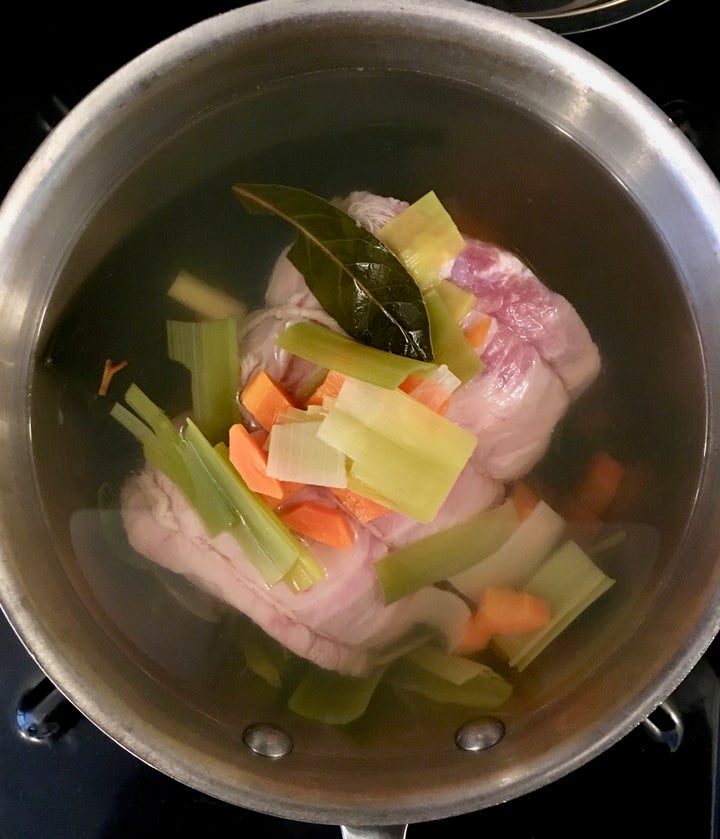 Rolled pork shoulder (coppa) about to be simmered