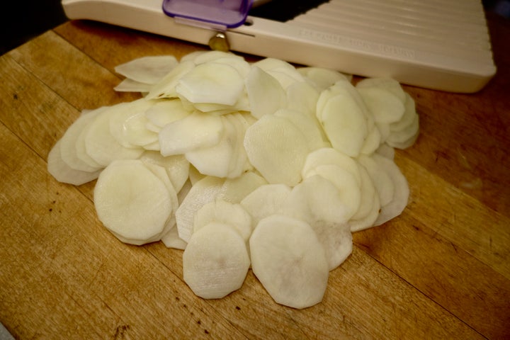 One way to julienne the potatoes is to slice them on a mandoline, then ...