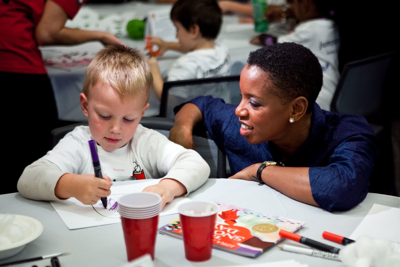 Then-Rep. Donna Edwards talks with a Jumpstart participant at an event in the Capitol Visitor Center in October 2010.