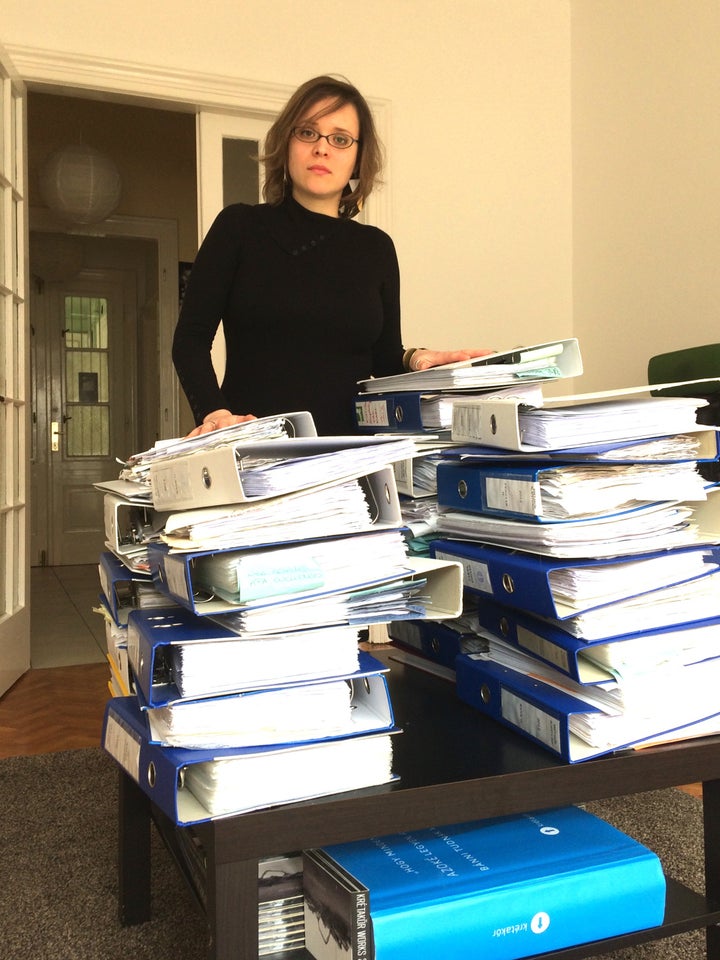 Stacks of trouble: Dóra Papp, Managing Director of Hungarian NGO Krétakör, with the files demanded by the tax authorities.