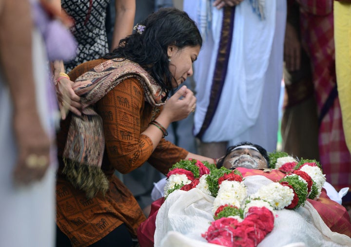 Sunayana Dumala says goodbye to her husband, Srinivas Kuchibhotla, during a funeral ceremony in India. Kuchibhotla was killed in Kansas by a man who allegedly screamed "get out of my country."