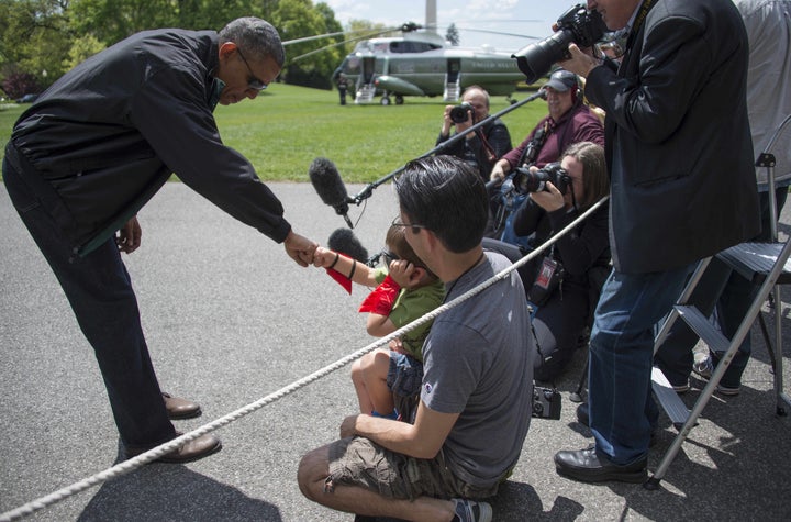 Obama fist bumps with 4-year-old Luca Martinez as he departs the White House in Washington, D.C., May 2, 2015.