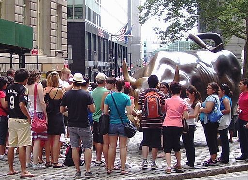 Tourists admiring Arturo di Modica’s Charging Bull in 2010.  