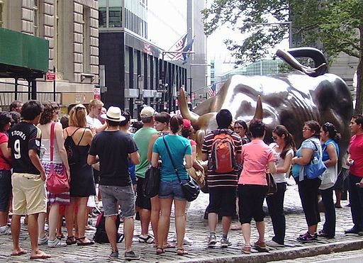 Tourists admiring Arturo di Modica’s <em>Charging Bull in 2010. </em>