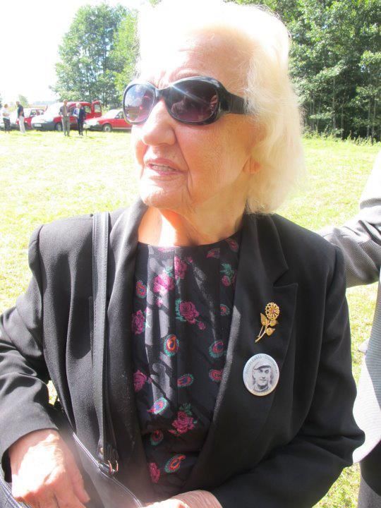 <p>Every year Nijolė would travel to the place where Juozas was killed in the ambush in 1951 to attend a memorial service. Here she is in 2011, wearing a pin with his image on her lapel.</p>