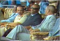 Samantar and Barre on gold thrones. Samantar, in his uniform, had complete control over the Somali military, including the m