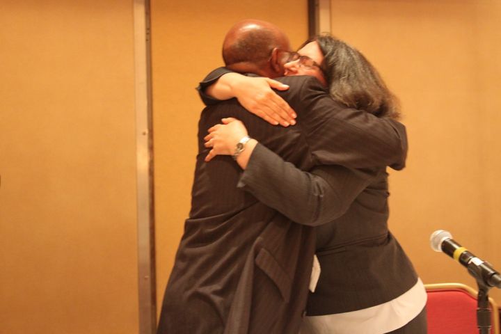 Kathy and Bashe hug after their victory in court 
