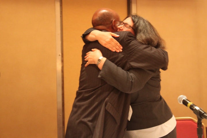 Kathy and Bashe hug after their victory in court