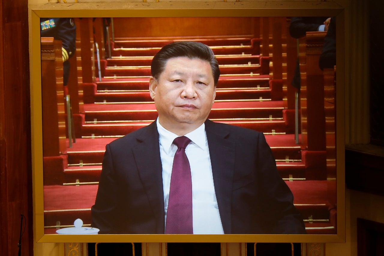 Chinese President Xi Jinping is seen on a giant screen during the opening session of the Chinese People's Political Consultative Conference (CPPCC) on March 3, 2017 in Beijing.