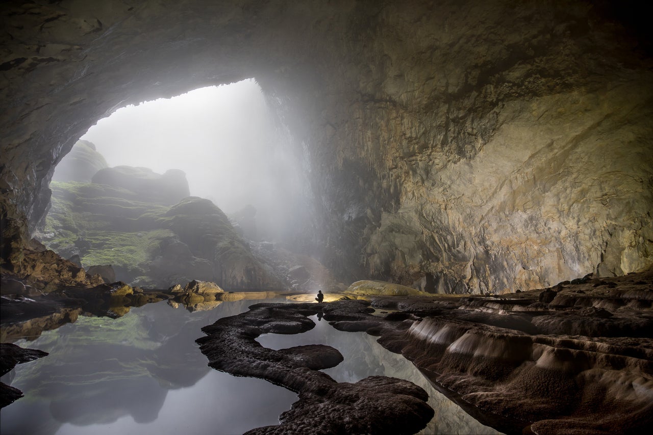 Vietnam's Son Doong cave, the largest in the world, could hold a 40-story skyscraper inside. The pristine ecosystem has its own river and jungle.