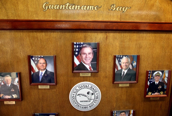 A photo of President Bush hangs alongside other government and military leaders in the headquarters of the U.S. Naval Base&nb