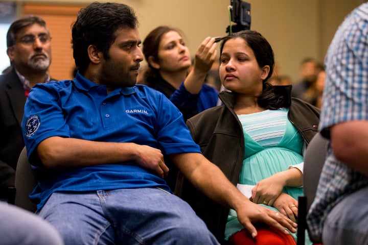 Alok Madasani and his wife Reepthi Gangula tear up while watching a dedication video during the Prayer Vigil that was held for the victims of the Austins Bar & Grill shooting on February 26, 2017 at the Ball Conference Center in Olathe, Kansas. Adam W. Purinton allegedly shot and killed Srinivas Kuchibhotla and wounded Alok Madasani, and an Austins Bar staff worker, Ian Grillot in what's being investigated as a hate crime.