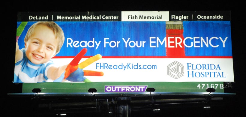 <em>After: the same billboard lit by energy-saving LED lights</em>