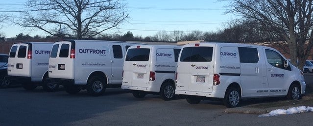 <em>OUTFRONT Media is beginning to use smaller, more fuel-efficient Chevy City Express vehicles, shown on the right (in Bosto