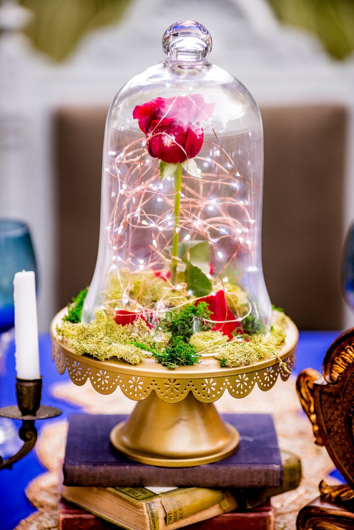 Tiny string lights add a magical quality to the enchanted rose. 