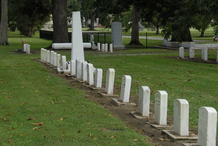 Tombstones with patient numbers and false identities at Carville.