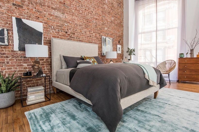 To have tranquility in your bedroom, Jonathan Scott says you can add densely woven draperies, thick area rugs and extra pillo