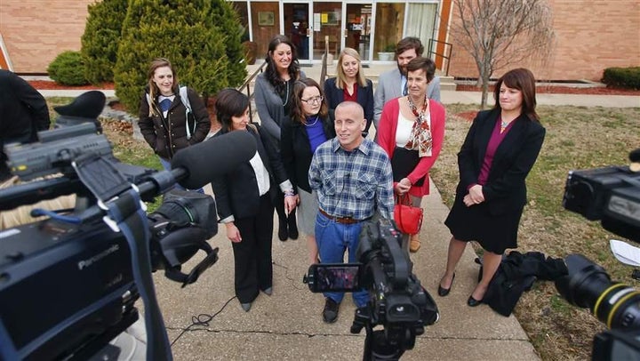 Floyd Bledsoe, center, after walking out of the Oskaloosa, Kansas, courthouse a free man in December 2015, after new evidence