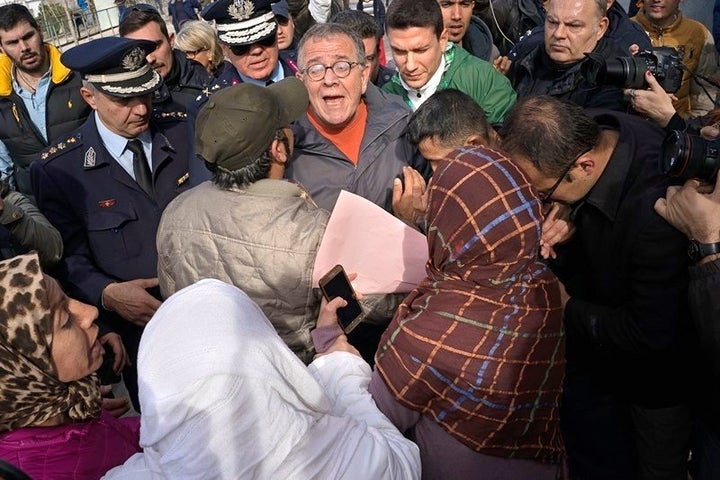 Greece’s migration minister Ioannis Mouzalas is mobbed by furious refugees outside the Elliniko camp in Athens.