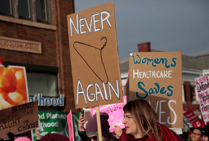 Supporters of Planned Parenthood rally outside a Planned Parenthood clinic in Detroit on Feb. 11, 2017.