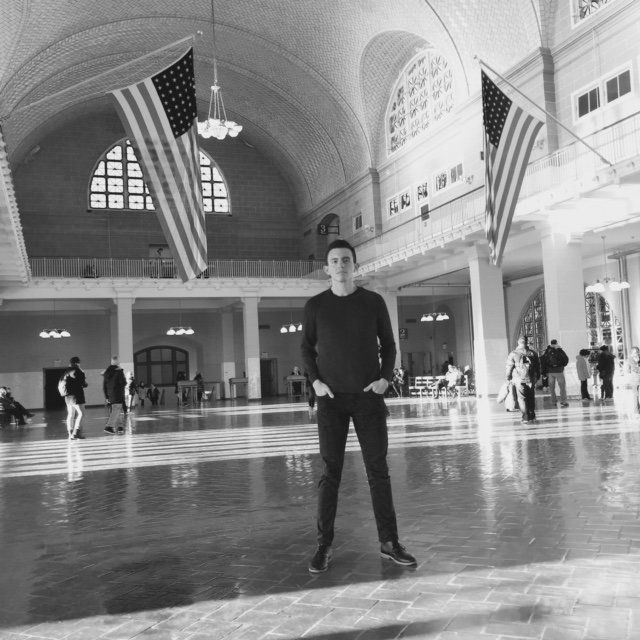 Mancheno, a gay refugee immigration lawyer, visits Ellis Island, where millions of immigrants first landed in the U.S. 
